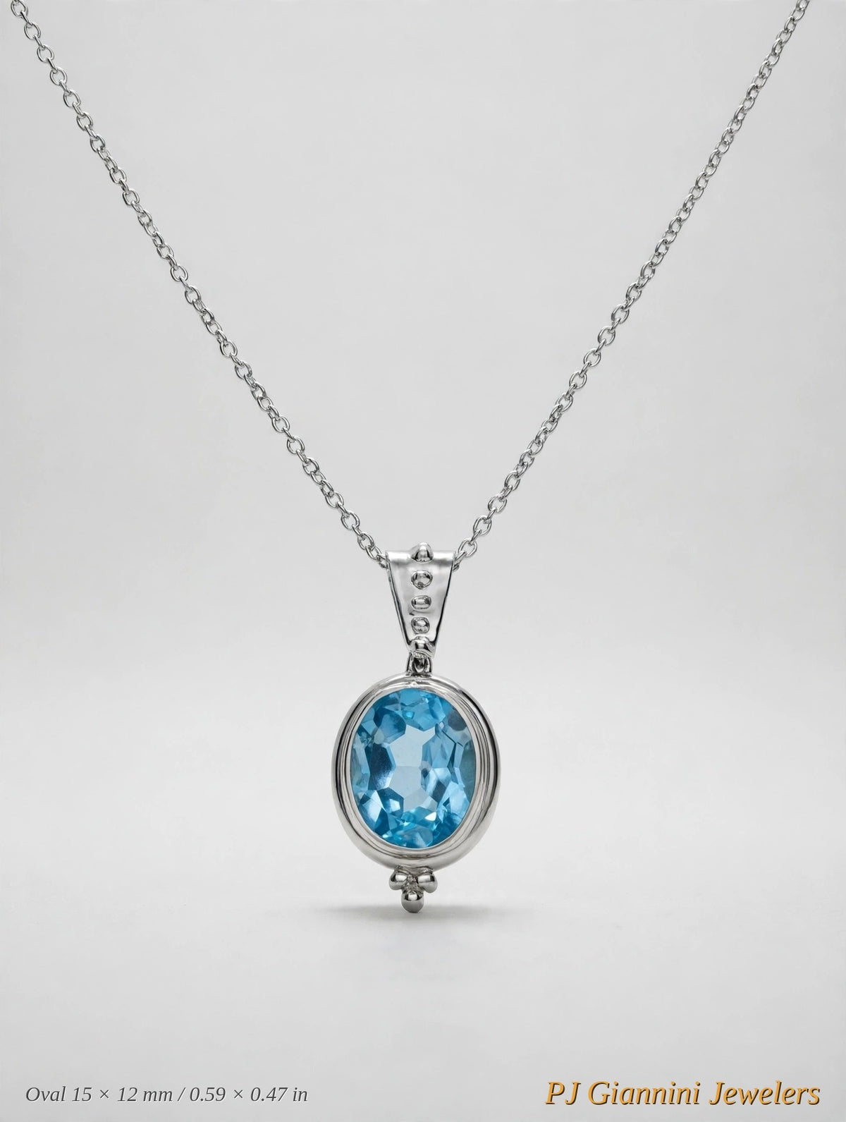 14K Gold Blue Topaz Oval Bezel Pendant Necklace — 18 in Sterling Silver Chain