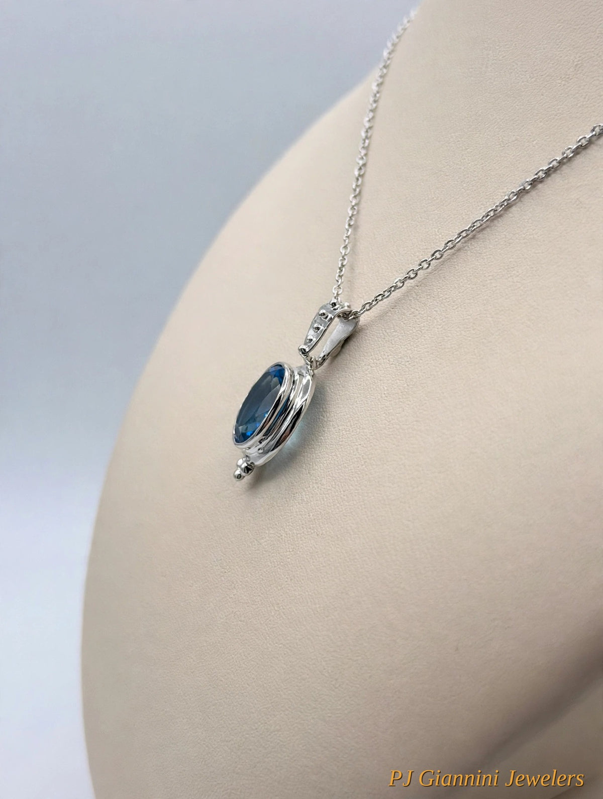 14K Gold Blue Topaz Oval Bezel Pendant Necklace — 18 in Sterling Silver Chain