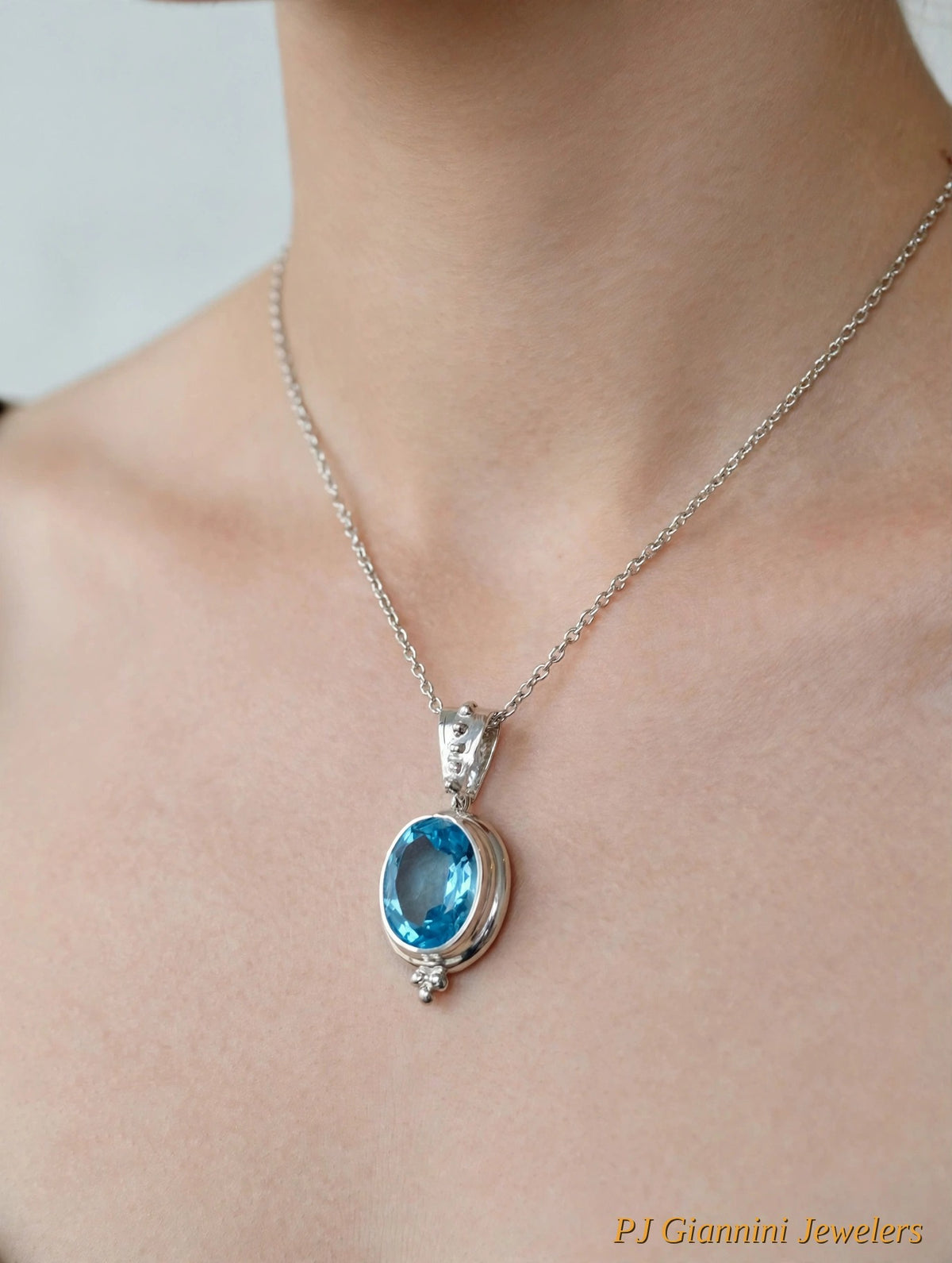 14K Gold Blue Topaz Oval Bezel Pendant Necklace — 18 in Sterling Silver Chain